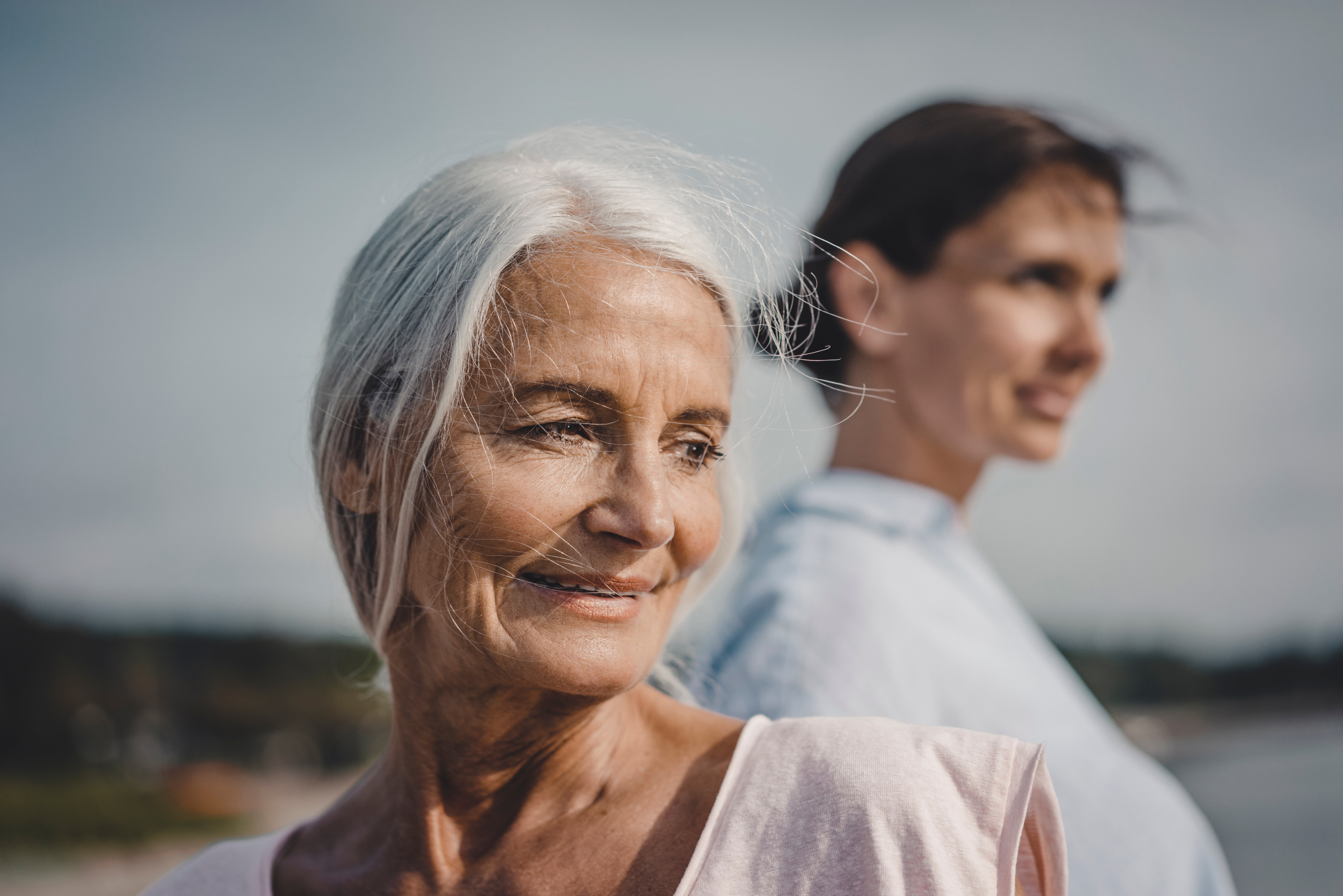 Mother and daughter spending a day at the sea, portrait
